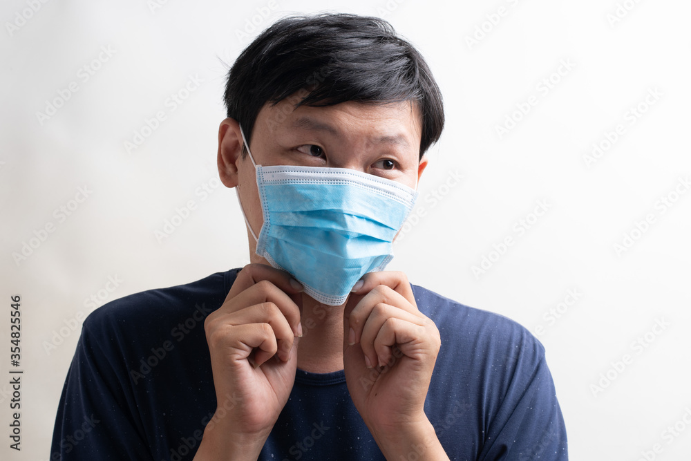 Man wearing facial hygienic mask. white background Virus protection against corona virus,covid19. City air pollution concept.