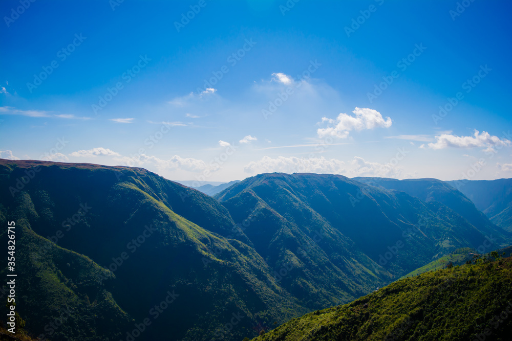 Natural view of the folded mountains and lush green valleys with clear sky and clouds of Cherrapunji, Meghalaya, North East India
Natural view of the folded mountains and lush green valleys with clear sky and clouds of Cherrapunji, Meghalaya, North East India