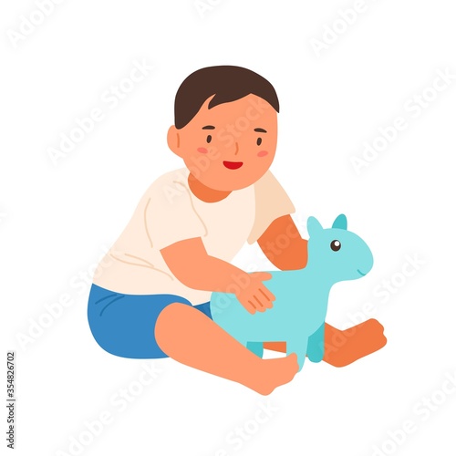 Cute smiling child playing with soft toy vector flat illustration. Happy litt...