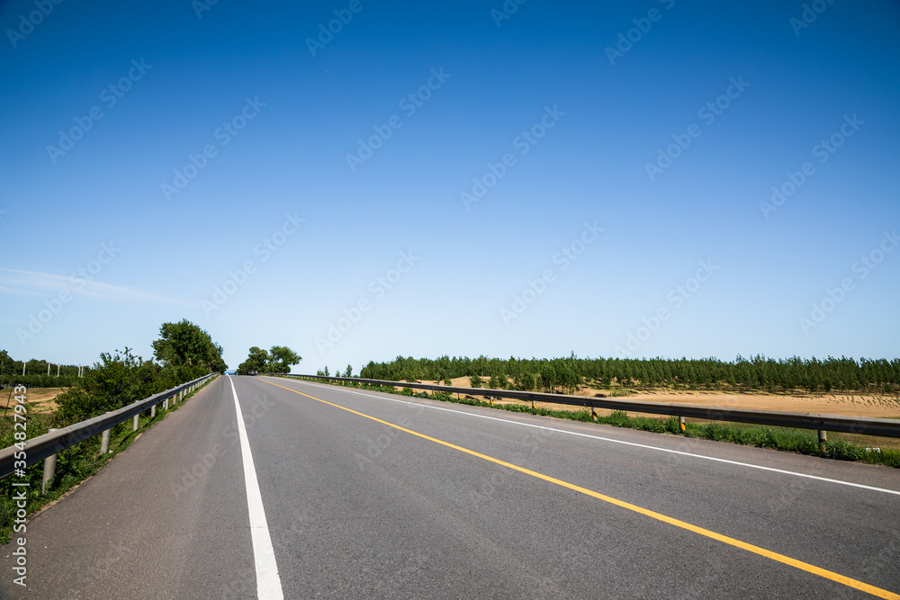 Picturesque country road and clear sky