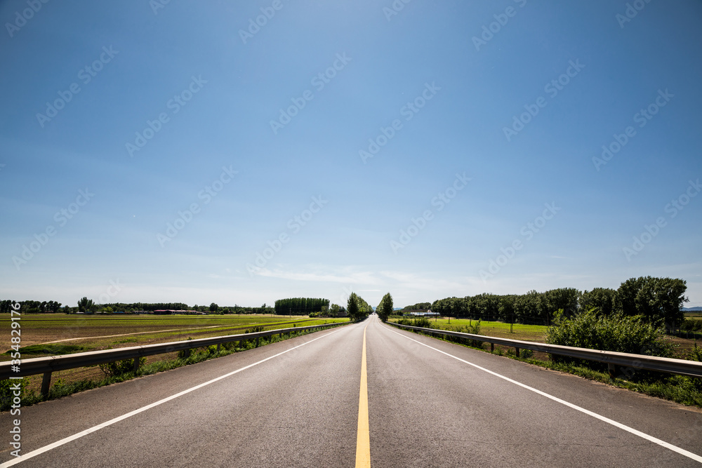 Picturesque country road and clear sky