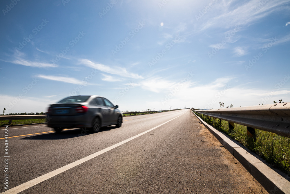 Fototapeta premium Picturesque country road and clear sky