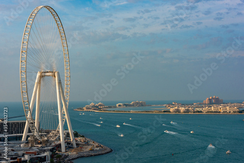 Photography Dubai, UAE - January 1, 2020: Ferris Wheel Ain Dubai on the Blue Water Island and Palm Jumeirah island