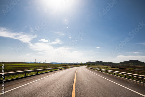 Picturesque country road and clear sky © daizuoxin