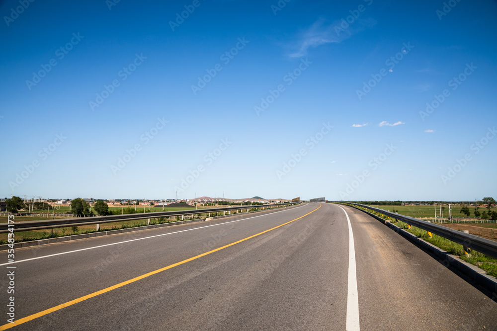 Picturesque country road and clear sky