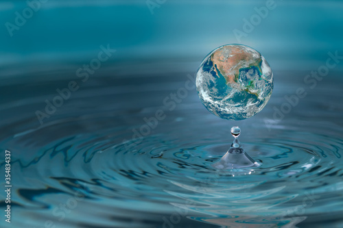 World dropping in a water drop  concept for water pullation and conservative.Elements of this image furnished by NASA