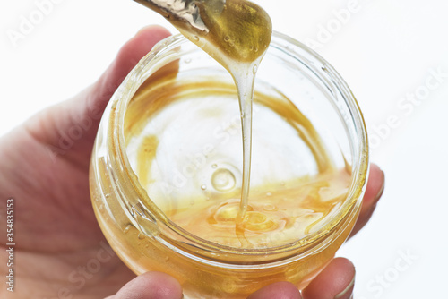 Beauty portrait of red head woman with gold mask on face. Skincare cleansing eco organic cosmetic