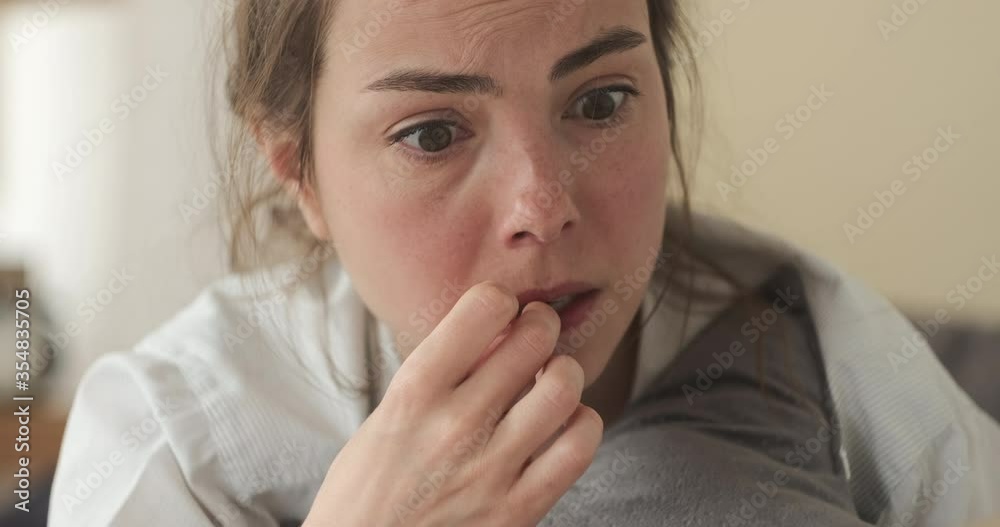 Sensitive woman crying while reading book at home Sensitive woman crying while reading book at home