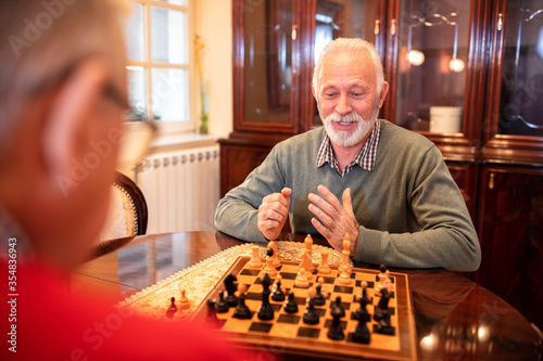 Older men playing a game of chess