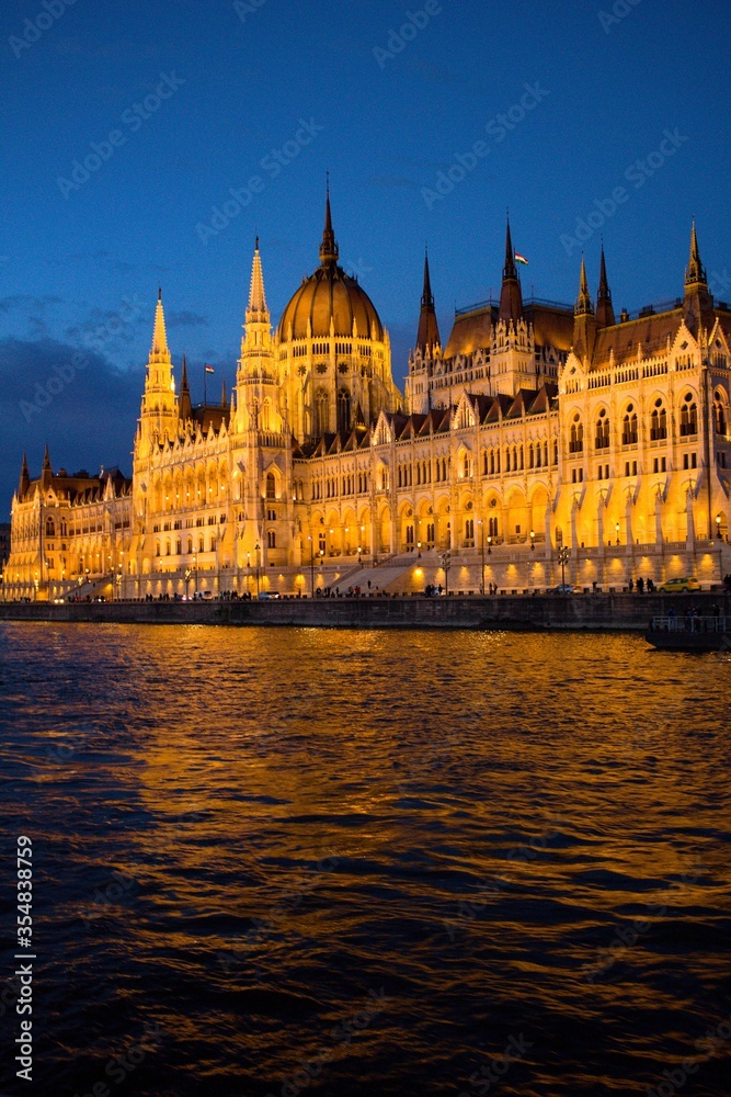 Fototapeta premium Hungarian Parliament Building (Országház) on the Danube at sunset 