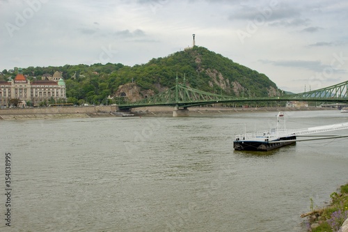 Landscape view of city Budapest, Hungary on the Dunabe river during cloudy and rainy day photo