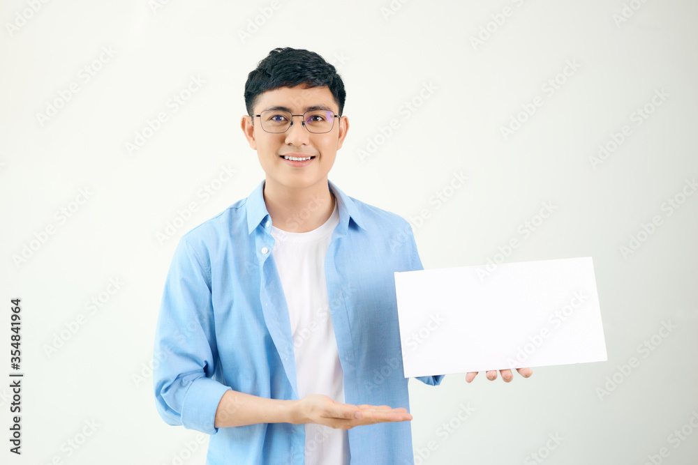 Asian young man showing pannel isolated on white background. Asian young man showing pannel isolated on white background.