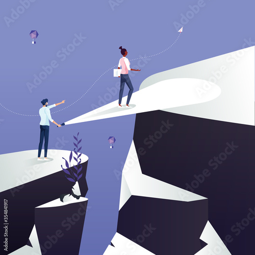 Business help and support concept. Leadership use flashlight help team across over the cliff