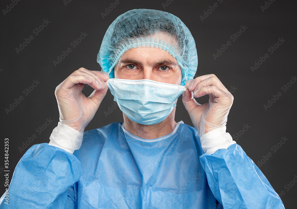 Professional surgeon in medical uniform and mask Professional surgeon in medical uniform and mask