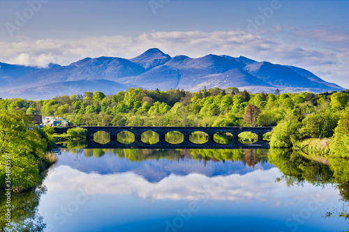 Scenic viewof reflected mountain in the river Laune