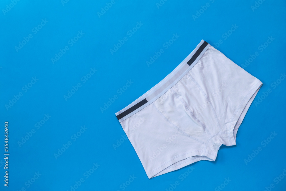Light men's underpants on a dark blue background.