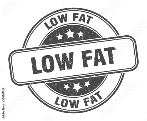 low fat stamp. low fat round grunge sign. label