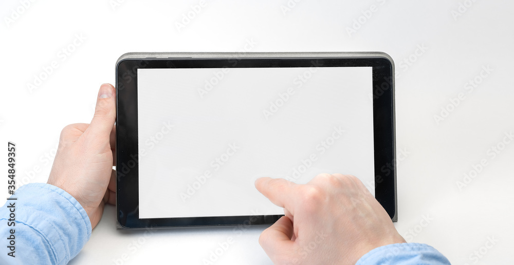 Male hands holding digital tablet blank screen horizontally on white background. Take your screen to put on advertising Male hands holding digital tablet blank screen horizontally on white background. Take your screen to put on advertising