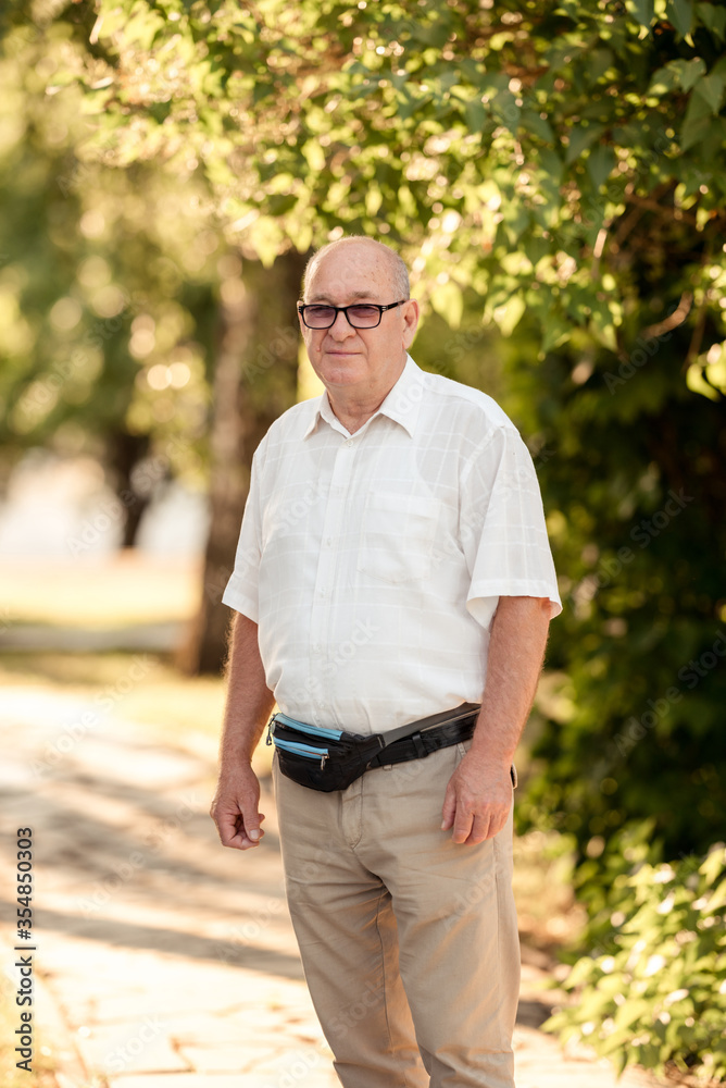 Senior Caucasian man with thoughtful expression outdoor. Senior Caucasian man with thoughtful expression outdoor.