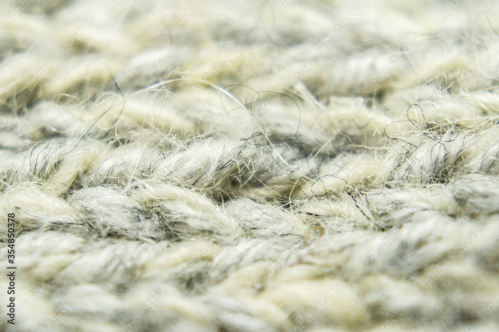 Large-knitted sheep wool close-up. Macro photography Large-knitted sheep wool close-up. Macro photography