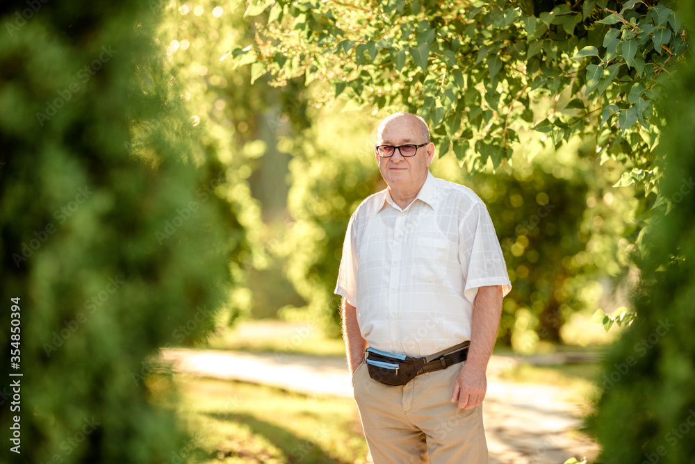 Senior Caucasian man with thoughtful expression outdoor. Senior Caucasian man with thoughtful expression outdoor.