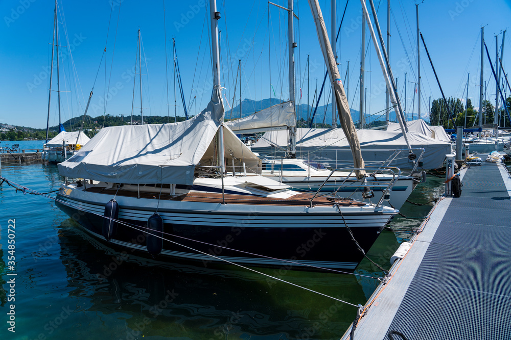 Fototapeta premium Wooden sailing boat firmly anchored in the boatyard.