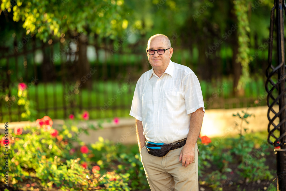 Fototapeta premium Senior Caucasian man with thoughtful expression outdoor.