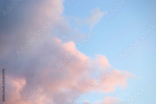 Photography Tender pink clouds in the blue sky texture.