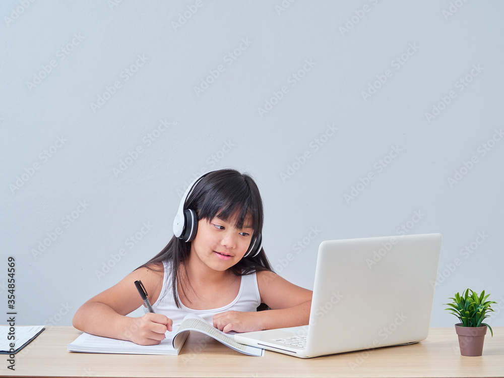 Little girl doing online class. Little girl doing online class.