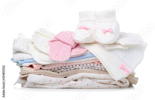 Stack folded of clothes for newborns on white background isolation