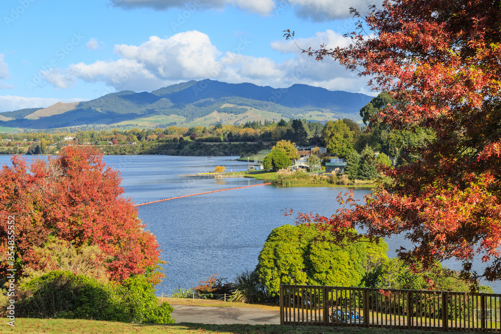 Lake Karapiro, an attractive man-made lake on the Waikato River, New Zealand, photographed in autumn. The boom across the water keeps boaters away from a dam