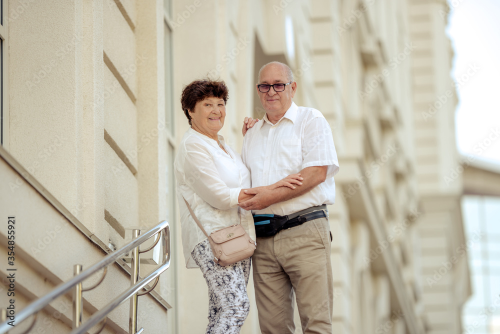 Handsome old man and attractive old woman are hugging Handsome old man and attractive old woman are hugging