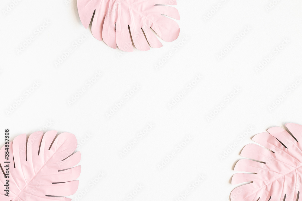 Summer composition. Tropical palm leaves on white background. Summer concept. Flat lay, top view, copy space Summer composition. Tropical palm leaves on white background. Summer concept. Flat lay, top view, copy space