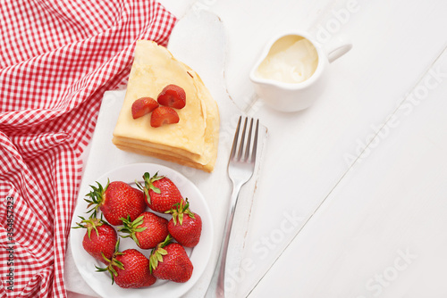 Strawberries and pancakes. Pancakes with strawberries. Romantic breakfast. Valentine s Day. Greeting Card Mother s Day. Breakfast in hotel room. Maslenitsa. Pancake week. Women s Day Congratulation