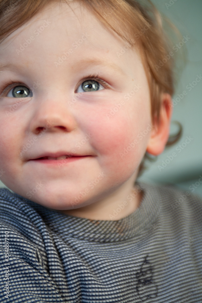 Little boy who has just woken from a sleep playing on his bed Little boy who has just woken from a sleep playing on his bed