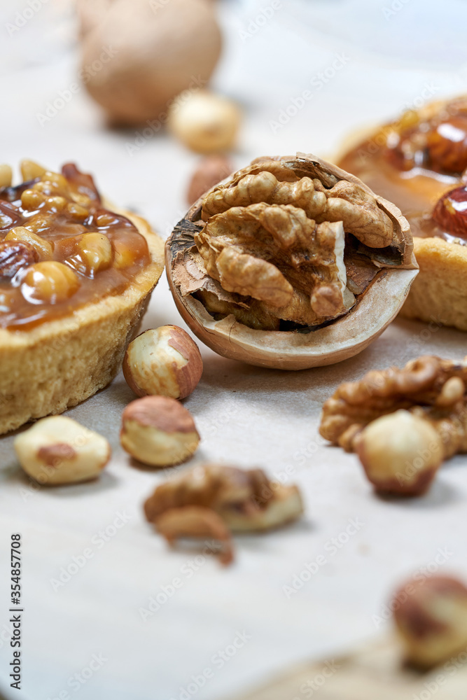 A round cake basket with nuts filled with condensed milk A round cake basket with nuts filled with condensed milk