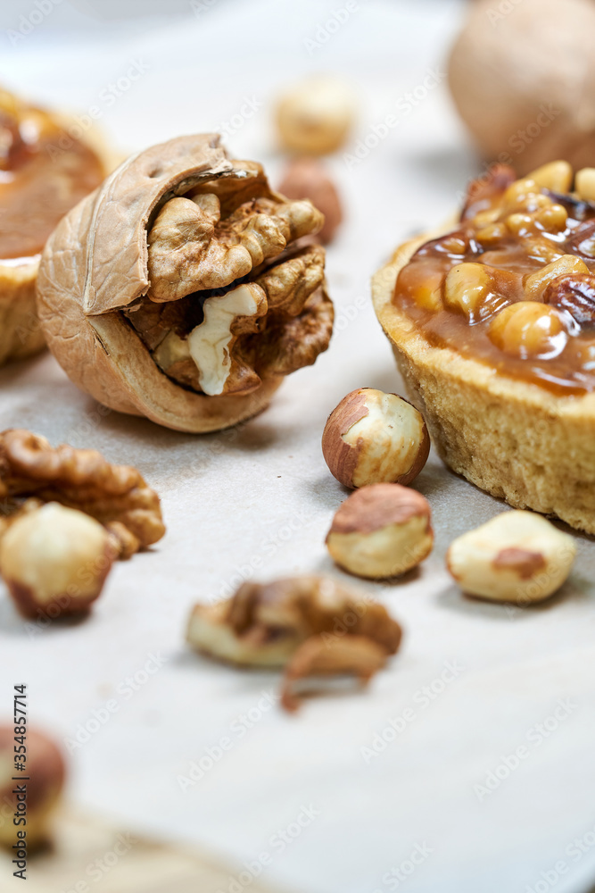 A round cake basket with nuts filled with condensed milk