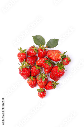 Group of fresh ripe strawberries on pink background