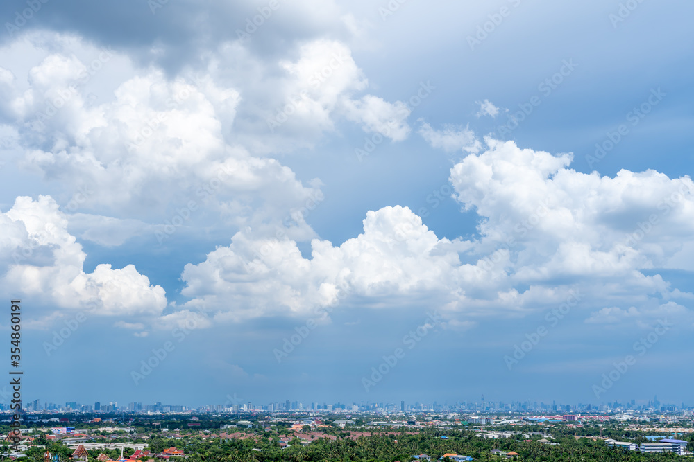 The sunlight shines at the beautiful white clouds in the blue sky And the ground floor is a view of Bangkok The sunlight shines at the beautiful white clouds in the blue sky And the ground floor is a view of Bangkok