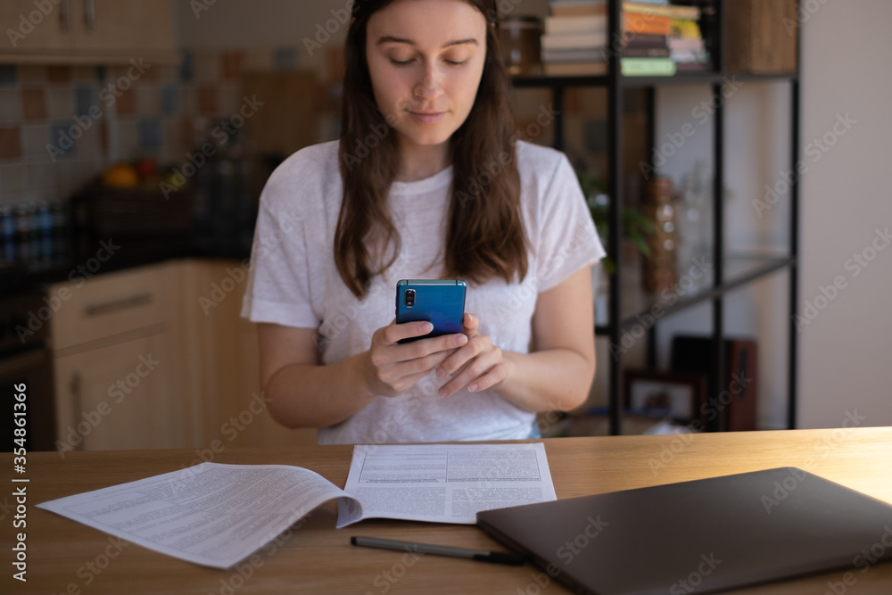 Young happy student, studying from home while self-isolating Young happy student, studying from home while self-isolating