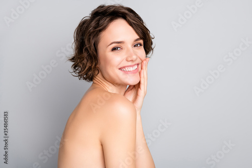 Closeup profile photo of beautiful nude lady short bob hairdo rejuvenation spa salon procedure soft facial skin touch arms cheekbone aesthetic isolated grey color background