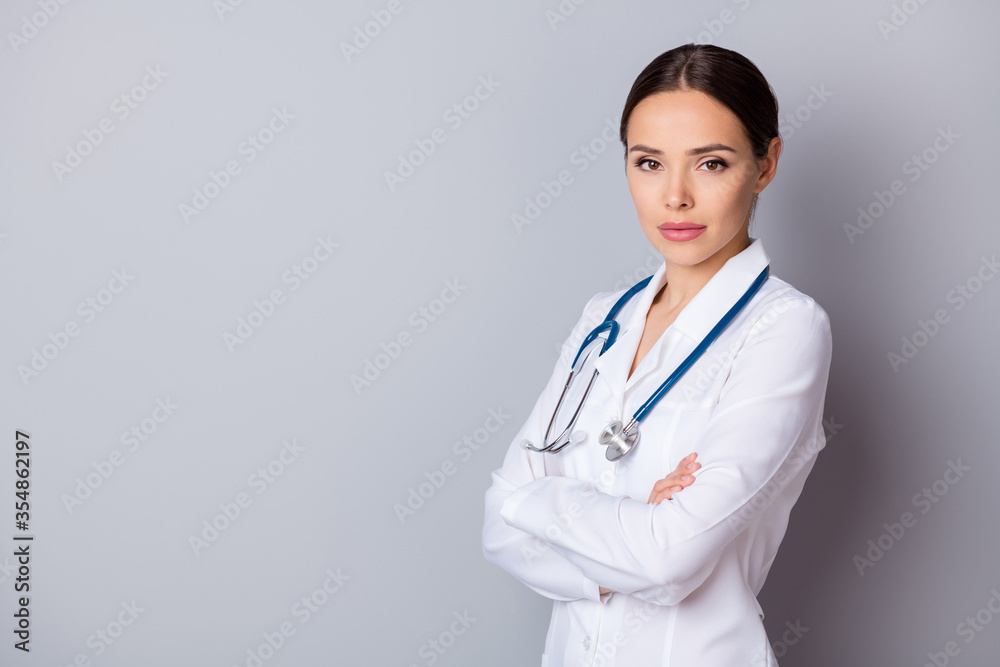 Profile photo of attractive family doc virologist not smiling experienced skilled professional arms crossed listen patient wear medical gown lab coat stethoscope isolated grey background Profile photo of attractive family doc virologist not smiling experienced skilled professional arms crossed listen patient wear medical gown lab coat stethoscope isolated grey background