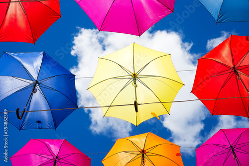 Colorful umbrellas background. Colorful umbrellas in the sky. Street decoration.
