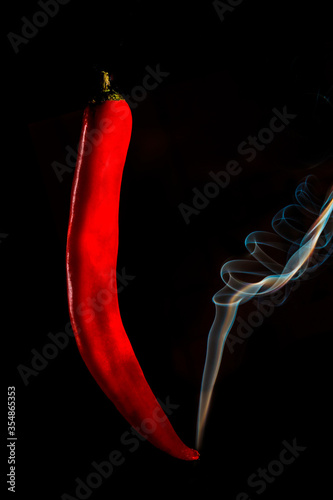 Steaming red pepper on a dark background