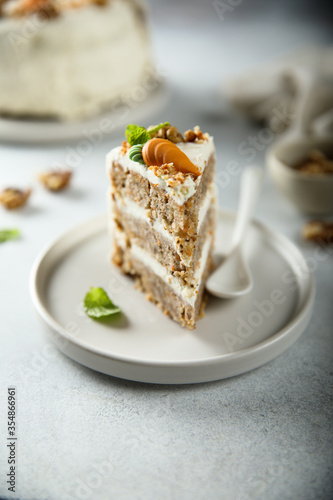 Traditional carrot cake with cream cheese and walnuts