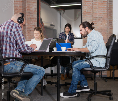 People working in co-working space