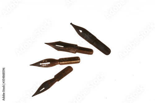 old and rusty nibs over white