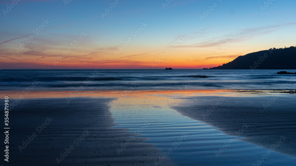 sunset on the beach sea Guernsey