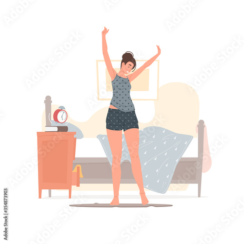 Happy young woman waking up in morning