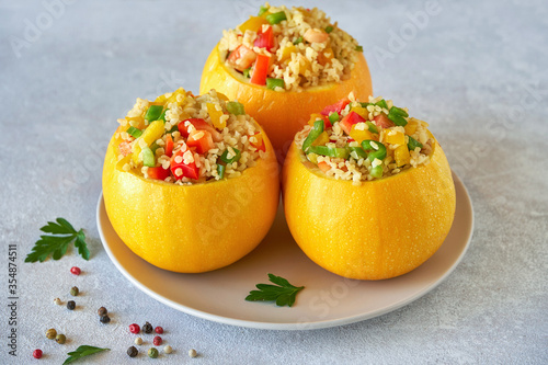 Round  courgette stuffed with bulgur and vegetables. 